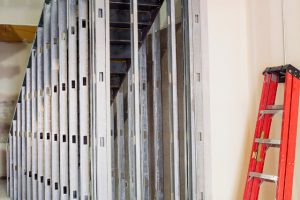 Commercial Drywall in Portland with an orange ladder for tall places