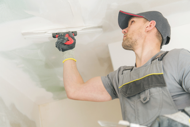 Drywall Remodel by worker in a home